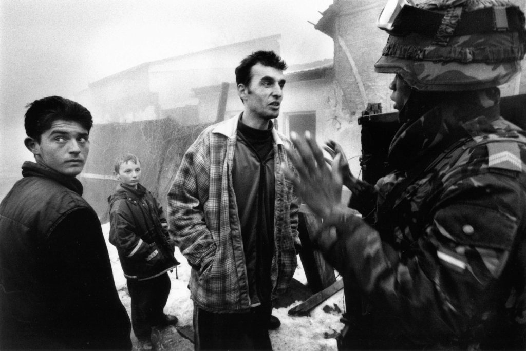 Albanians trie to occupy Serbian houses. Mitrovica, Kosovo, 1999
