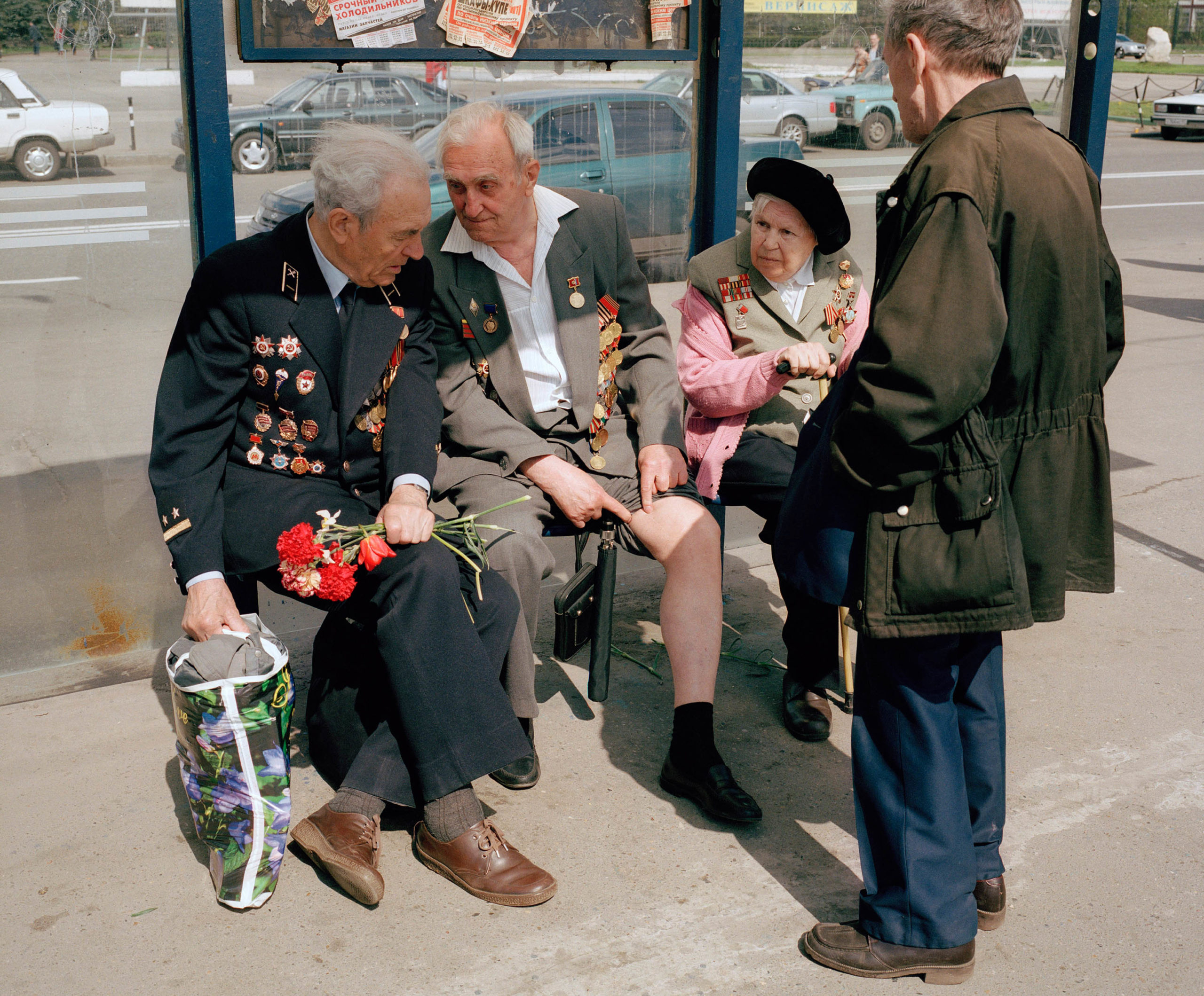 Russia, Moscow. Victory Day. War veteran shows his old war wounds.