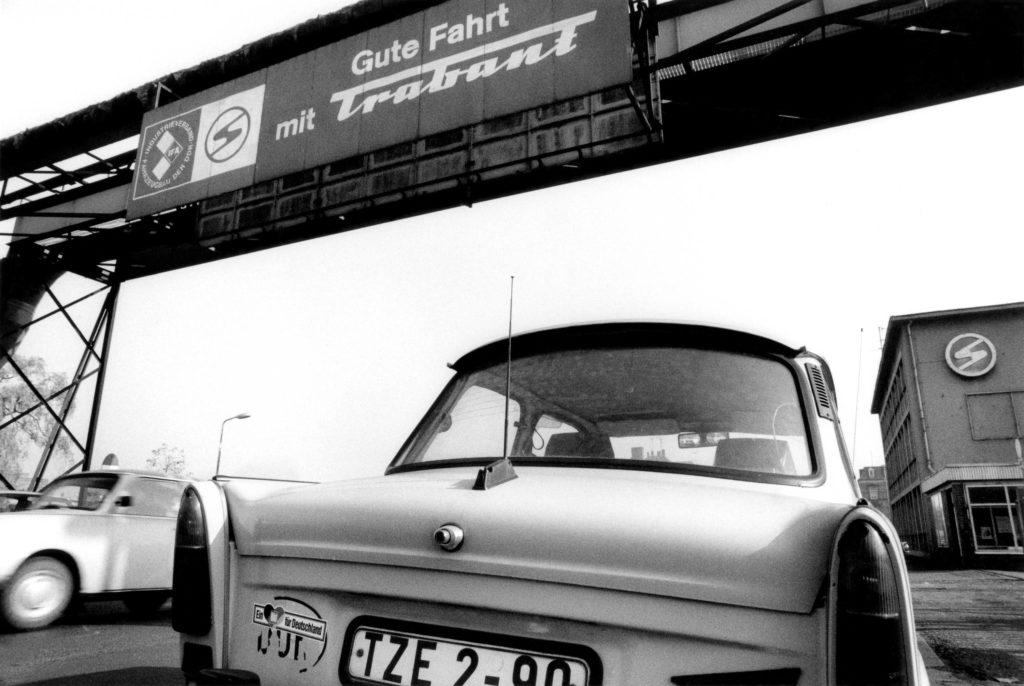 “Have a good trip with Trabant”. Main entrance of the Sachsenring Automobilwerke, Zwickau 1990.