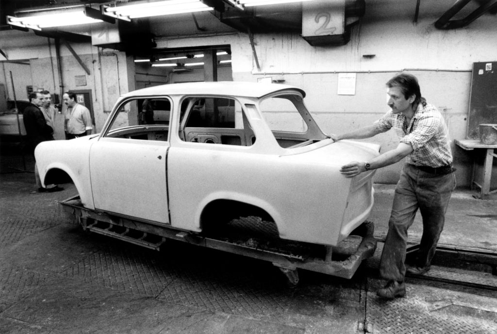Unfinished Trabant being pushed along for further work, 1990