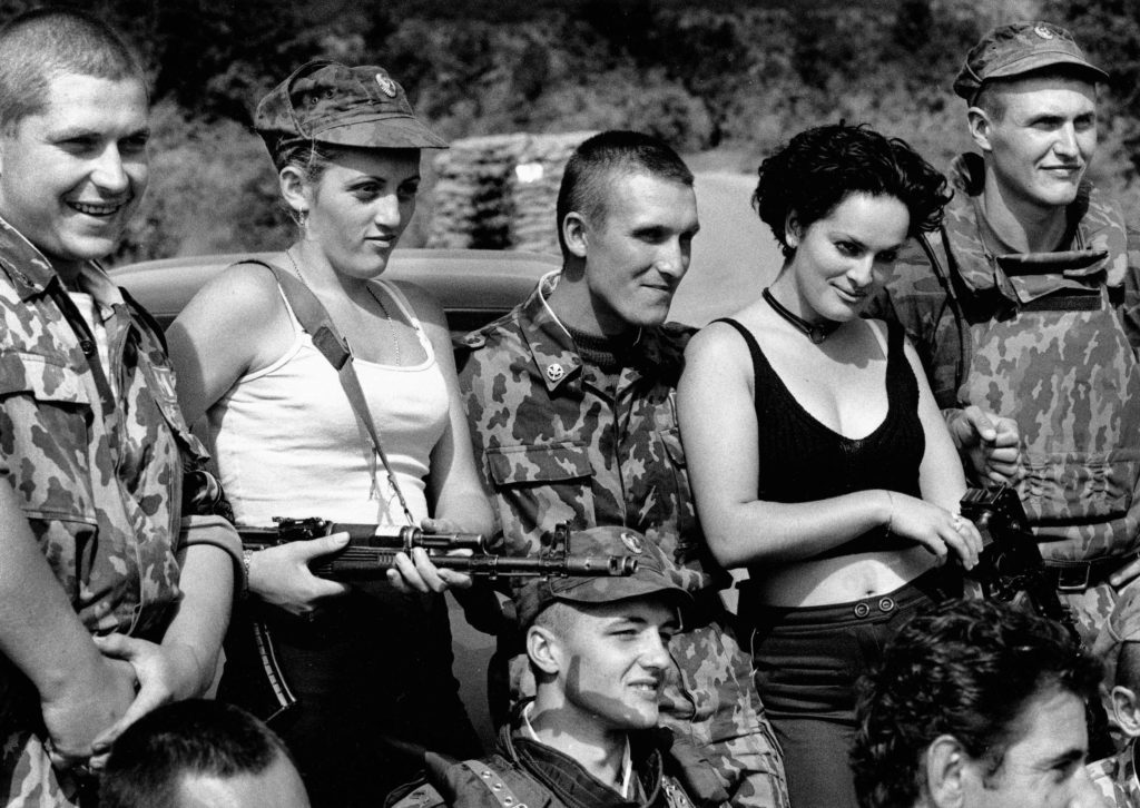 Russian soldiers with prostitutes. Mališevo, Kosovo, 2000